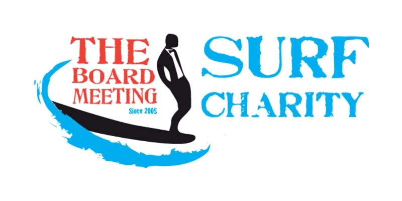 Logo for "The Board Meeting Surf Charity" featuring a person in a suit standing on a surfboard with a blue wave, and the words "THE BOARD MEETING Surf Charity Since 2005" in bold red and blue text.